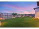 Expansive backyard with artificial grass, offering a low-maintenance and pristine outdoor space at 484 Windstone Crest Ave, Las Vegas, NV 89138