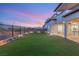 Spacious backyard features manicured lawn and extended patio for outdoor entertaining at 484 Windstone Crest Ave, Las Vegas, NV 89138