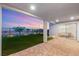 Covered patio leads to a well-maintained lawn, with sliding glass doors opening to dining space at 484 Windstone Crest Ave, Las Vegas, NV 89138