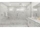 Bathroom featuring a glass shower, dual shower heads, and double sinks at 484 Windstone Crest Ave, Las Vegas, NV 89138