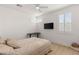 Serene bedroom with a ceiling fan, modern desk, and a plush bed for ultimate comfort at 484 Windstone Crest Ave, Las Vegas, NV 89138