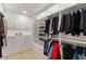 This walk-in closet features custom shelving and rods at 484 Windstone Crest Ave, Las Vegas, NV 89138