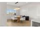 Well-lit dining area featuring modern lighting, stylish chairs, and contemporary decor at 484 Windstone Crest Ave, Las Vegas, NV 89138