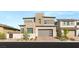 Modern two-story home featuring stylish stone accents and a well-manicured front yard at 484 Windstone Crest Ave, Las Vegas, NV 89138
