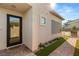 Inviting front entrance with a glass door, brick walkway, and manicured landscaping at 484 Windstone Crest Ave, Las Vegas, NV 89138