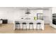 Stylish kitchen with sleek countertops, modern appliances, and barstool seating at 484 Windstone Crest Ave, Las Vegas, NV 89138