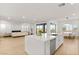 Bright, open-concept kitchen featuring a large island, stainless steel appliances, and seamless flow to the living area at 484 Windstone Crest Ave, Las Vegas, NV 89138