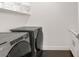 Convenient laundry room with front load washer and dryer and storage space at 484 Windstone Crest Ave, Las Vegas, NV 89138