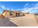 The backyard showcases ample space for landscaping, complemented by the home's exterior at 522 Copper Falcon Ave, Henderson, NV 89011