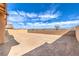 Large backyard with a brick wall and open space ready for landscaping and outdoor activities at 522 Copper Falcon Ave, Henderson, NV 89011