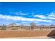 The backyard brick wall with mountain views offers privacy and scenic backdrop at 522 Copper Falcon Ave, Henderson, NV 89011