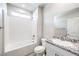 Clean, bright bathroom with granite countertop, tub, and shower at 522 Copper Falcon Ave, Henderson, NV 89011