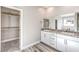 Bathroom with double vanity, granite countertop and walk-in closet at 522 Copper Falcon Ave, Henderson, NV 89011