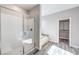 Bathroom featuring walk-in shower, soaker tub and walk-in closet at 522 Copper Falcon Ave, Henderson, NV 89011