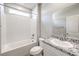 Clean, bright bathroom with granite countertop, tub, and shower at 522 Copper Falcon Ave, Henderson, NV 89011