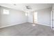 Comfortable bedroom offers neutral tones, new carpeting, and a ceiling fan for added comfort at 522 Copper Falcon Ave, Henderson, NV 89011