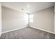 A carpeted bedroom features a window and neutral walls at 522 Copper Falcon Ave, Henderson, NV 89011