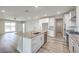 Modern kitchen boasts granite countertops, stainless steel appliances, and large island for entertaining at 522 Copper Falcon Ave, Henderson, NV 89011
