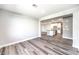 Open living room flows into a modern kitchen with a large island and stainless steel appliances at 522 Copper Falcon Ave, Henderson, NV 89011