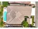 Bird's eye view showcases the backyard's tile roof, pool, and landscaping at 5260 Acqua Ln, Pahrump, NV 89061