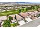 Spacious homes in a desert golf community, showcasing manicured lawns and stunning mountain views at 5260 Acqua Ln, Pahrump, NV 89061