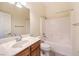 Clean bathroom boasts a vanity, mirror, and tub-shower combination at 5260 Acqua Ln, Pahrump, NV 89061