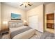 Comfortable bedroom featuring a queen bed, closet and neutral decor at 5260 Acqua Ln, Pahrump, NV 89061
