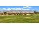 Picturesque community view featuring lush green spaces and stunning mountain vistas at 5260 Acqua Ln, Pahrump, NV 89061
