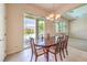 Inviting dining area with sliding glass doors leading to a backyard and ample natural light at 5260 Acqua Ln, Pahrump, NV 89061