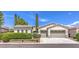 Charming single-story home featuring desert landscaping and a spacious three-car garage at 5260 Acqua Ln, Pahrump, NV 89061