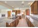 Open concept kitchen featuring an island and stainless appliances, flowing into the living area at 5260 Acqua Ln, Pahrump, NV 89061