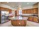 Spacious kitchen with wood cabinets, granite countertops, and stainless steel appliances at 5260 Acqua Ln, Pahrump, NV 89061