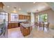 Open-concept kitchen with stainless steel appliances and breakfast bar seating at 5260 Acqua Ln, Pahrump, NV 89061