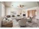 Bright, airy living room featuring modern furniture, neutral tones, and a cozy fireplace at 5260 Acqua Ln, Pahrump, NV 89061