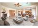 Spacious living room open to the kitchen featuring a fireplace and modern décor at 5260 Acqua Ln, Pahrump, NV 89061