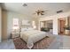 Comfortable bedroom featuring carpet, neutral paint, ceiling fan, and natural light at 5260 Acqua Ln, Pahrump, NV 89061