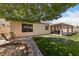 Large backyard features a cozy patio, lush lawn, and is perfect for relaxing and enjoying the outdoor space at 5310 Eel River Ct, North Las Vegas, NV 89031