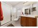 Bathroom featuring a shower with glass doors, single sink and vanity at 5310 Eel River Ct, North Las Vegas, NV 89031
