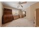 Spare bedroom featuring carpet floors, a ceiling fan, and a minimalistic style creating a blank canvas at 5310 Eel River Ct, North Las Vegas, NV 89031