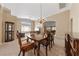 Open dining area featuring carpet flooring and a decorative chandelier at 5310 Eel River Ct, North Las Vegas, NV 89031