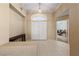 Bright foyer featuring tile flooring, a decorative light fixture, and a view of the interior at 5310 Eel River Ct, North Las Vegas, NV 89031