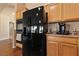 Kitchen featuring stainless steel appliances, wood cabinets and granite countertops at 5310 Eel River Ct, North Las Vegas, NV 89031