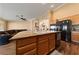 Spacious kitchen island with a sink, wood cabinets, and granite countertops at 5310 Eel River Ct, North Las Vegas, NV 89031