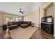 Spacious living room with hardwood floors, large windows, and comfortable furnishings at 5310 Eel River Ct, North Las Vegas, NV 89031