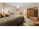 Inviting main bedroom featuring neutral walls, a comfy sitting area, and wooden furniture for a cozy retreat at 5310 Eel River Ct, North Las Vegas, NV 89031