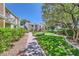 Beautifully maintained lawns and brick walkways connecting residences with lush trees providing ample shade at 590 Tam O Shanter, Las Vegas, NV 89109