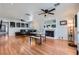 Open-concept living room with hardwood floors and cozy fireplace at 590 Tam O Shanter, Las Vegas, NV 89109