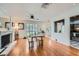 Well-lit living room boasts hardwood floors, fireplace and eat in kitchen at 590 Tam O Shanter, Las Vegas, NV 89109