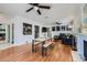 Bright living room with hardwood floors, fireplace, and dining space at 590 Tam O Shanter, Las Vegas, NV 89109