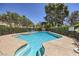 A community pool with shallow and deep ends, along with a surrounding concrete deck and safety signage at 590 Tam O Shanter, Las Vegas, NV 89109